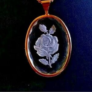 Vintage clear carved lucite oval rose pendant in goldtone with chain necklace